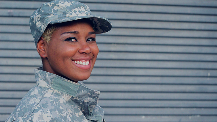 Female Veterans smiling into the camera