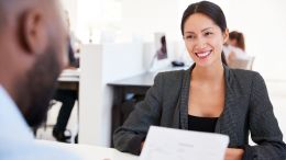 Asian business woman at offer stage of interview process